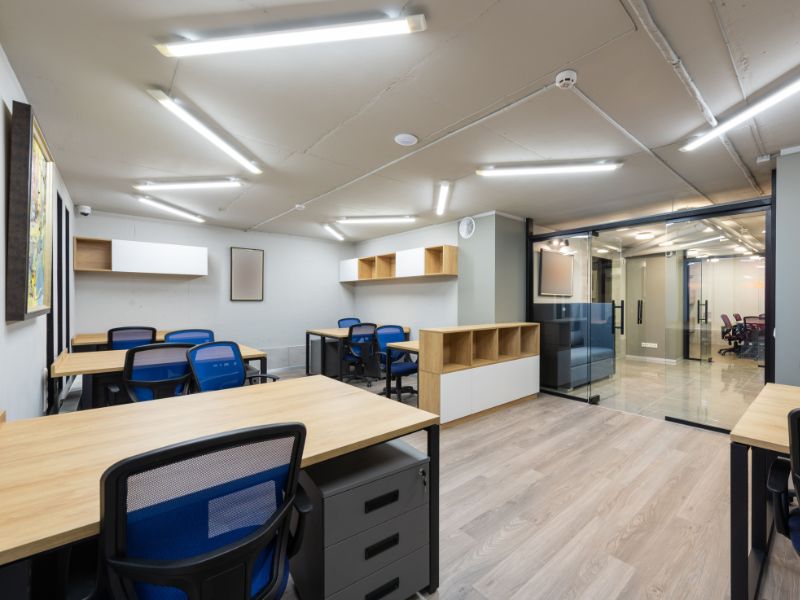 Professionally cleaned commercial office workstations in Brisbane with dust-free surfaces and sparkling clean glass partitions.